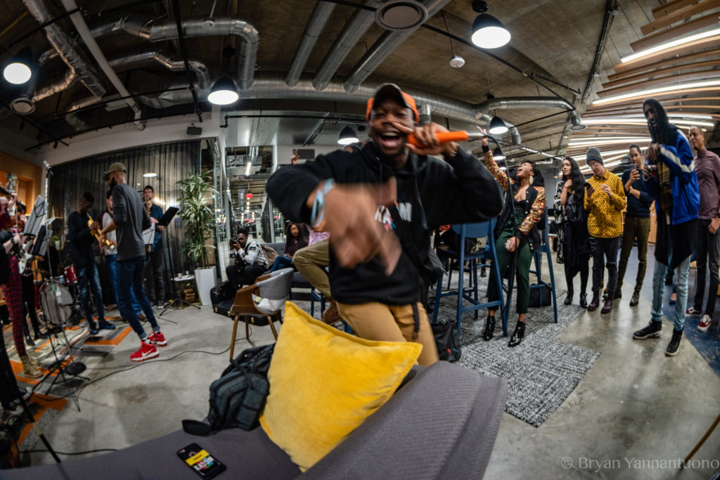 Fisheye action shot of a rapper performing