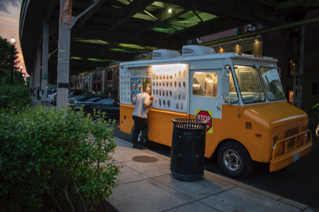 Street photography - A warm evening photograph of a man ordering at an ice cream truck in the Georgetown neighborhood of Washington, DC