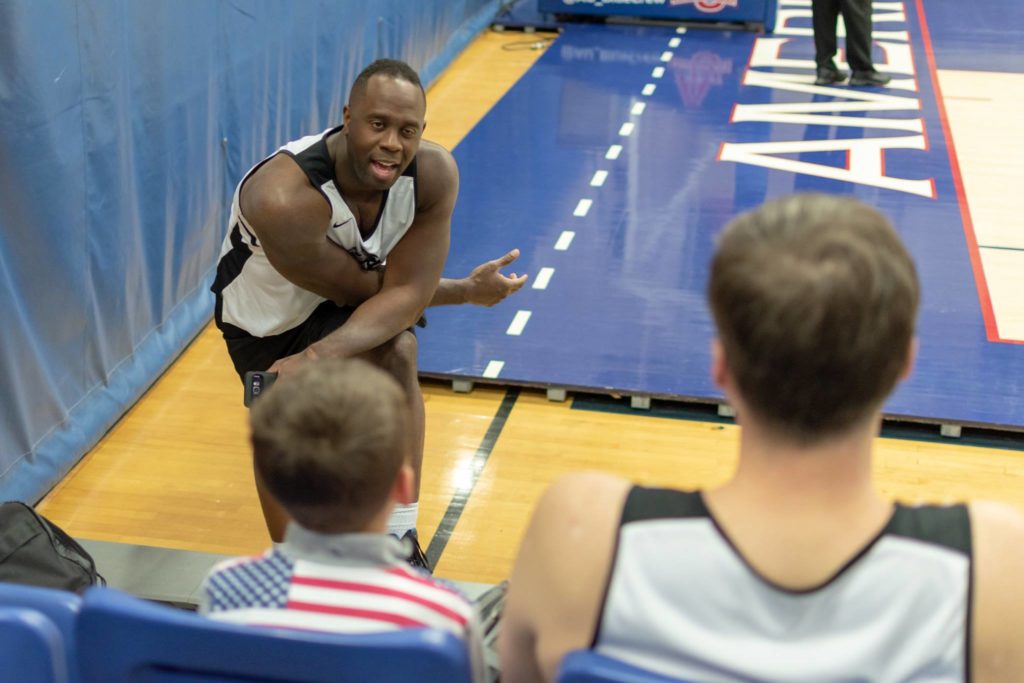 A player speaks to a young fan and his father