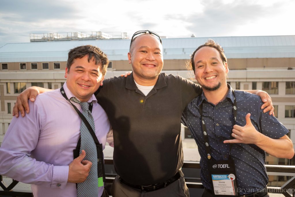 Photo of 3 conference attendees smiling