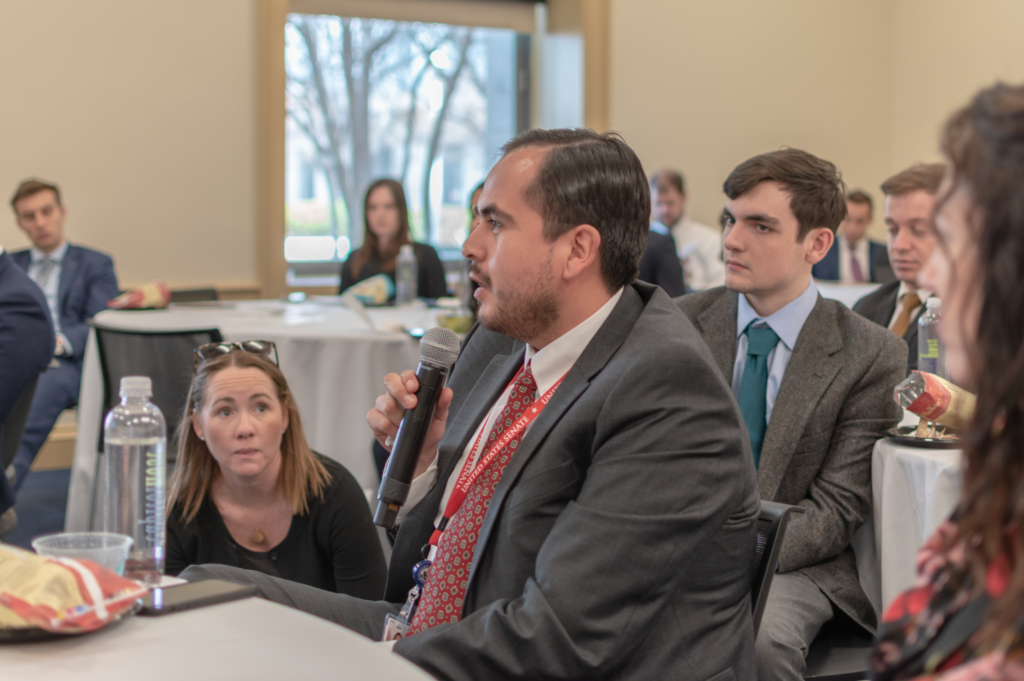 Photograph of a man asking a question at an event